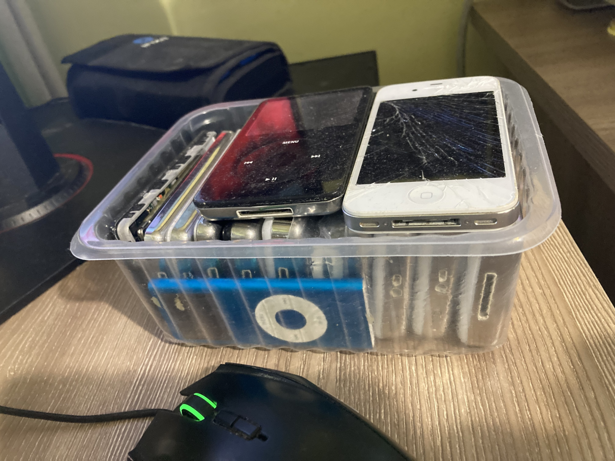 A plastic box full of iPods as listed below