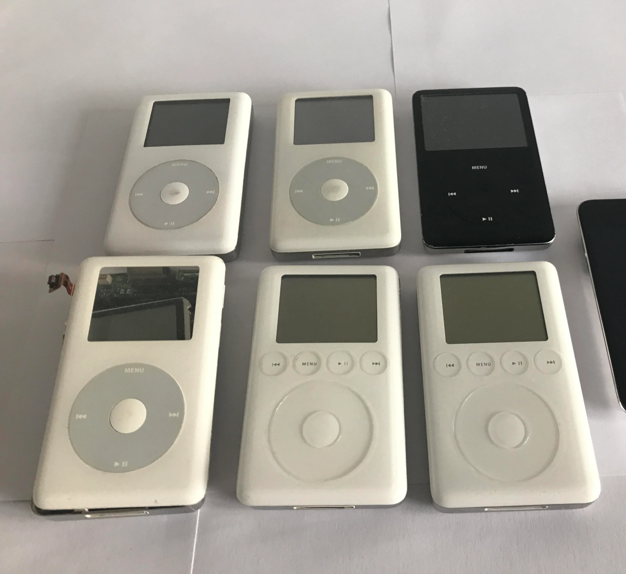 Picture of some of my iPod Classics, including 3rd gens, 4th gens and a 6th gen